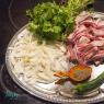 Delicious pork ribs with potatoes in a cauldron over a fire Recipe for khash in a cauldron pork ribs